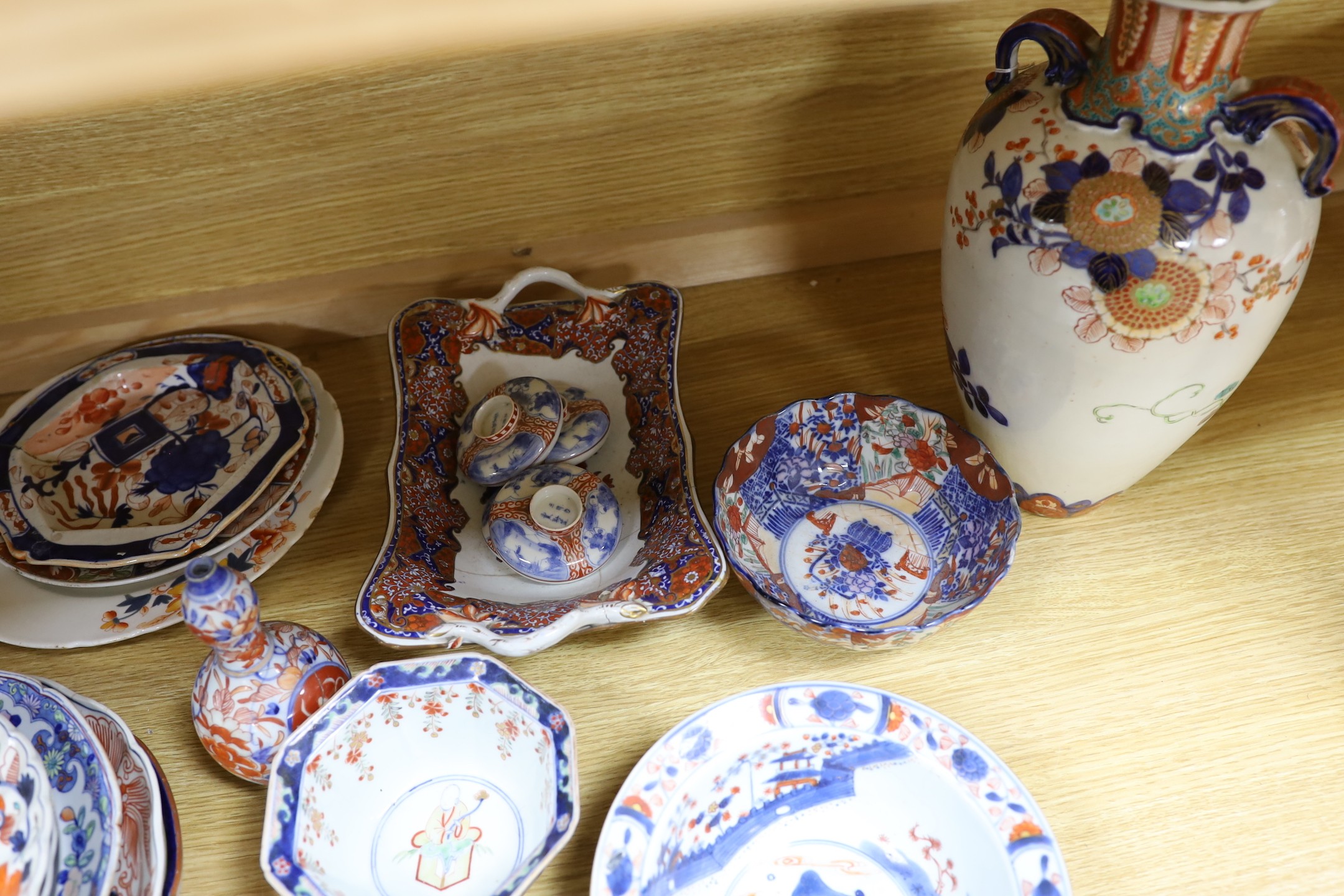 A Japanese Imari two handled vase, a Kangxi Imari bowl a/f and a collection of similar Japanese and continental ceramics